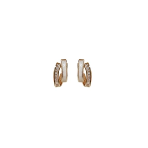 Elegant gold earrings with white enamel and sparkling zircons in a layered geometric design