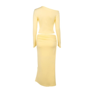 Rear view of yellow two-piece knit set featuring one-shoulder top and maxi skirt
