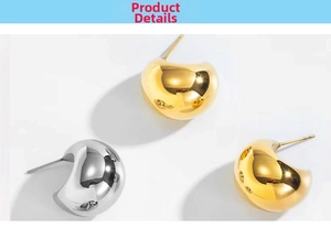 Close-up of chunky dome earrings in high-polished gold and silver mirror finish