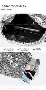 Macro detail of silver woven tote interior with multiple pockets and large storage space