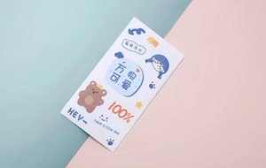 Macro detail of cartoon planner stickers with bear and girl designs on split background