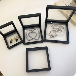 Three sizes of black PE film jewelry display boxes showing suspended gold earrings and necklaces