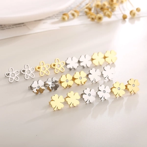 Detail showing assorted hollow floral and clover stud earrings in gold and silver finish