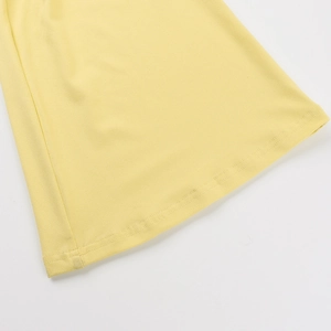 Detailed macro view of the bright yellow fabric showing fine texture and double-needle stitching