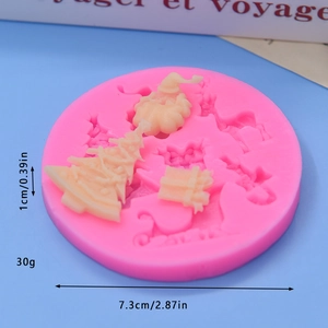 Pink silicone mold with Christmas tree and gift box designs for DIY cake baking and crafts