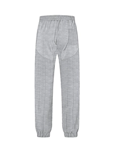 Detail view of grey drawstring sweatpants with elastic waist and fabric texture