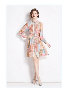 Detail of floral print maxi dress featuring long sleeves and matching waist belt