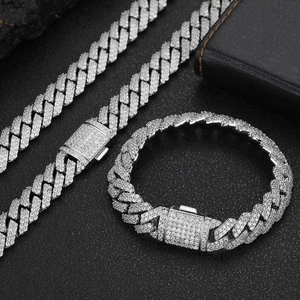 Detail view of 12mm silver cuban link chain and bracelet with sparkling zircon stones