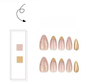 Detail of short almond press-on nails with nude pink and gold foil glitter designs