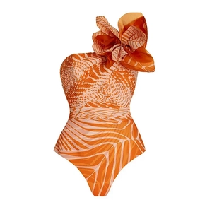 Detail of salmon orange geometric print one-shoulder swimsuit with large 3D floral decoration