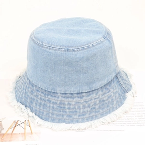 Frayed edge light blue denim bucket hat with vintage washed finish and fringe detailing