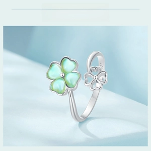Close-up of S925 sterling silver open ring featuring green lucky clover leaf details