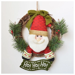 Detail of Christmas wreath with plush Santa, pine branches, berries and HO! HO! HO! sign