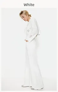 Detail of white vintage blouse showing hollow embroidery and ruffle tie neckline texture