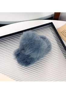 Detailed view of the soft blue-grey faux rabbit fur texture on a plush hair claw clip