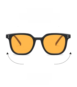 Front detail of black square frame sunglasses featuring retro orange lenses and silver rivets