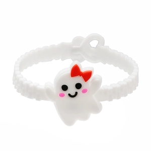 Detail of white silicone Halloween bracelet featuring a cute ghost charm with red bow