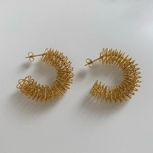 Chunky gold-plated stainless steel spring coil hoop earrings in vintage style