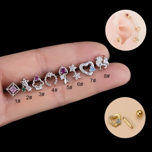 Set of eight silver cartilage earrings with colorful zircons and flower heart designs