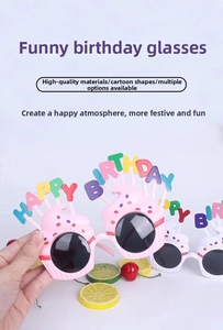 Close-up of Happy Birthday party glasses featuring colorful cupcake frames and polka dots