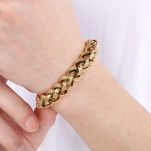 Close-up of gold titanium steel braided bracelet on wrist showing punk link detail