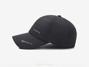 Detail view of black sports baseball cap with embroidered logo on quick-dry fabric