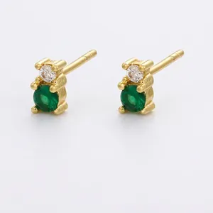 Detailed view of bear-shaped gold brass earrings with green gems and white zircon stones