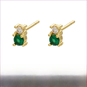 Detailed view of bear-shaped gold brass earrings with green gems and white zircon stones