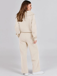 Back view of beige women's casual lounge set showing long sleeve sweatshirt and wide pants