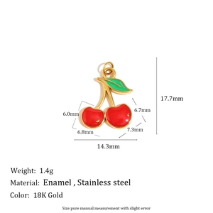 Macro detail of cherry enamel pendant with 18K gold plated stainless steel frame