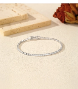 Macro shot of silver S925 sterling silver tennis bracelet with round cut cubic zirconia
