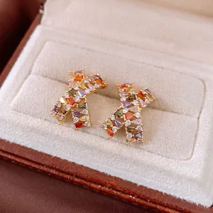 18k gold plated X-shaped cross stud earrings featuring colorful pave zircon stones