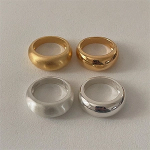 Detail view of 925 sterling silver rings in gold and silver with matte and mirror finish