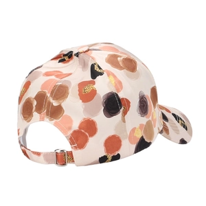 Floral print baseball cap in beige with sparkling gold accents and adjustable back strap