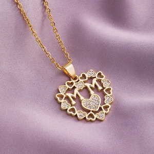 Elegant gold heart-shaped MOM pendant necklace with sparkling cubic zirconia crystals