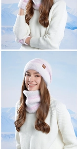 Detail of white and pink gradient winter knit hat, scarf and gloves set on snow background