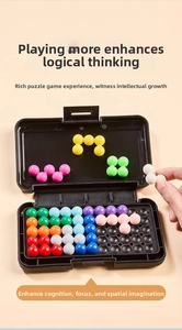Macro detail of a logic puzzle with colorful interconnected spheres on a black grid base