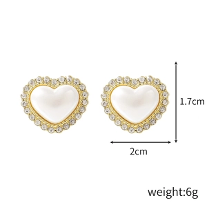 Elegant gold-tone heart stud earrings with white pearl center and crystal frame