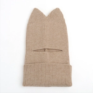 Macro detail of camel knit cat ear balaclava showing soft ribbed texture and warm design
