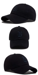 Detail view of cotton baseball cap featuring high-quality Gothic 'B' embroidery