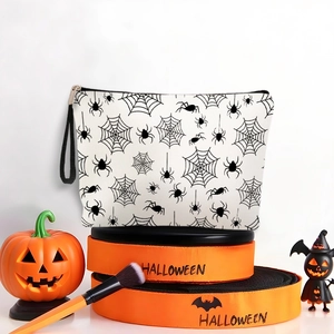 Halloween spider web makeup bag with zipper and wrist strap on festive background