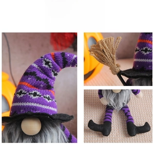 Detail of Halloween gnome showing knitted striped hat, faux beard and mini broom prop