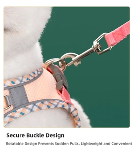 Detail of safety buckle and breathable mesh on pink reflective dog harness and leash