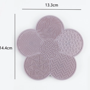 Macro detail of lavender silicone makeup brush cleaner mat with texture and size dimensions