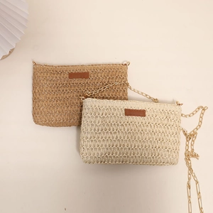 Minimalist straw crossbody bag with metal chain strap in khaki and cream white tones