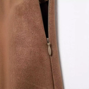Brown knit blazer and skirt set featuring a premium quality hidden zipper closure detail