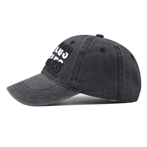 Detailed macro view of Los Angeles 3D embroidery on washed grey denim baseball cap