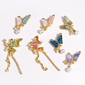 Set of 7 gold butterfly pendants featuring micro-pave zircons and pearls on white background