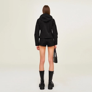 Slim-fit black hooded windbreaker jacket with matching shorts and boots from back view