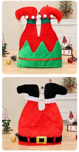 Detailed view of plush Christmas chair covers featuring elf and Santa leg designs with bells